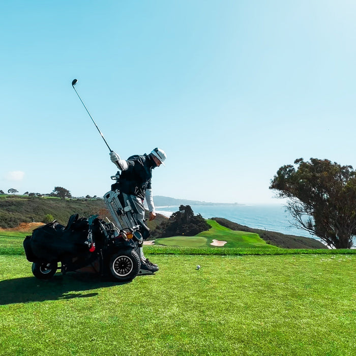 The backswing of Amplife® Foundation & Amplife® Founder Abdul Nevarez's 2nd one-armed hole-in-one as a right above knee amputee with severe nerve damage in his left arm and left leg in an adaptive golf cart at Torrey Pines North Course 15th