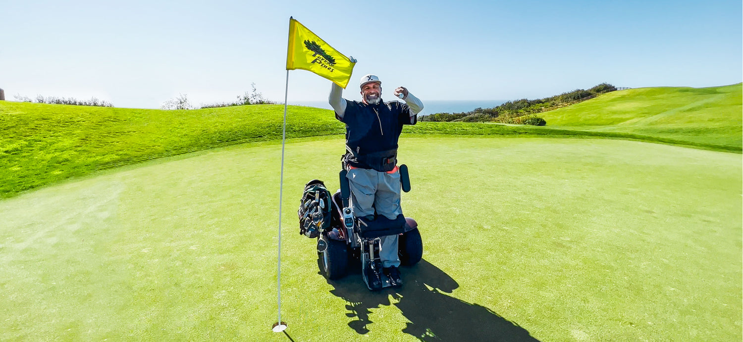 Abdul Nevarez holding the ball on the green of Torrey Pines North 15th after his 2nd ace as a right above knee amputee with severe nerve damage in his left arm and left leg in an adaptive golf cart.