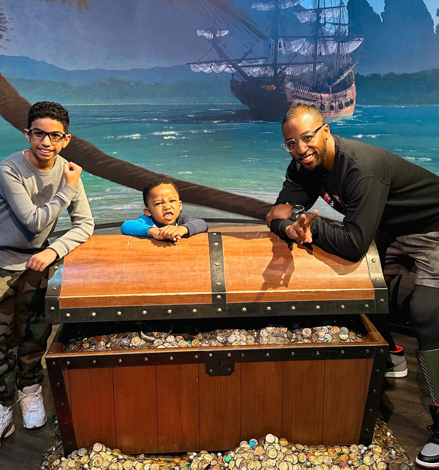 Amplife® Foundation Cause. Amplife® & Amplife® Foundation Founder Abdul Nevarez and Team Amplife® Ambassador Michael Braxton Jr. looking at a pirate's treasure in an art museum with his kids.