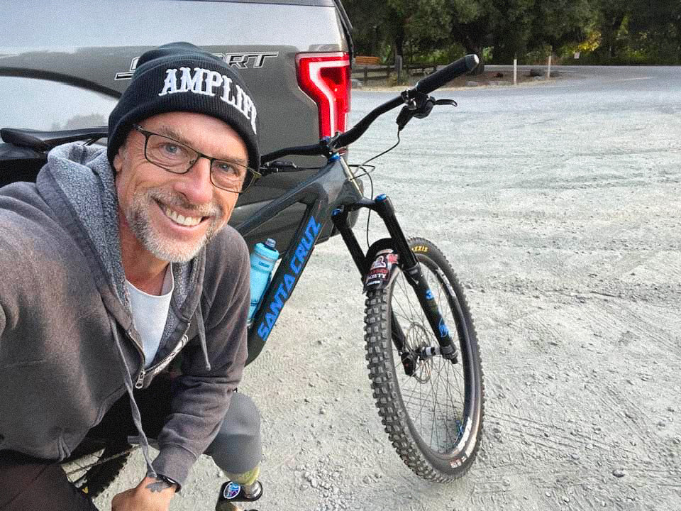 Team Amplife® Ambassador Andrew May wearing the Amplife® Beanie before riding his downhill mountain bike.