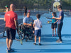 Cincinnati Tennis Foundation beginner adaptive spring tennis participants and coach juggling a tennis ball on a racket.