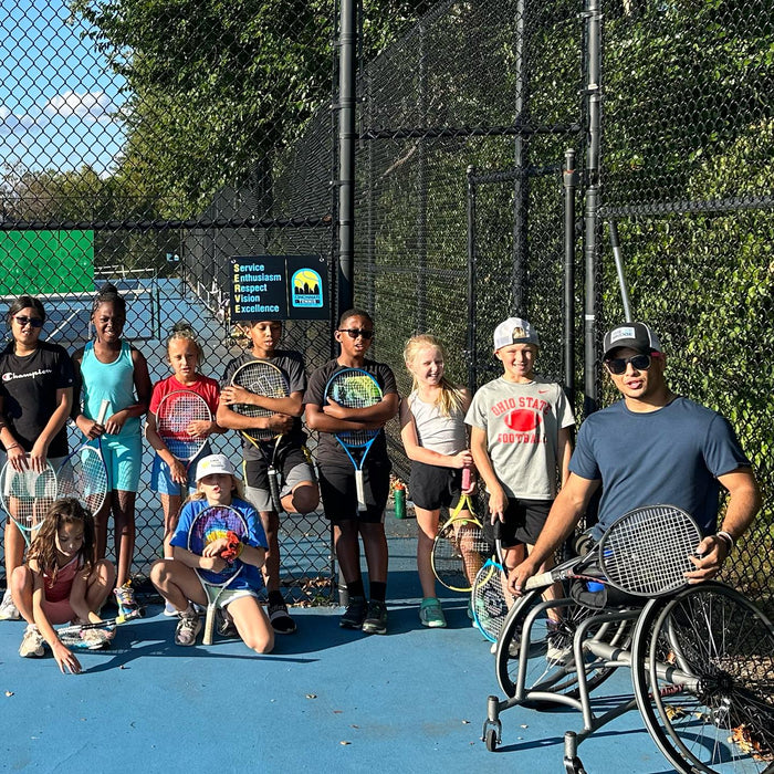 Group portrait of Cincinnati Tennis Foundation beginner adaptive spring tennis participants and coach.