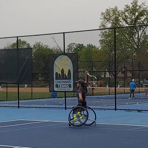 A Cincinnati Tennis Foundation advanced wheelchair tennis participant  getting ready to serve.