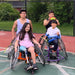 Group portrait of Cincinnati Tennis Foundation advanced wheelchair tennis participants.