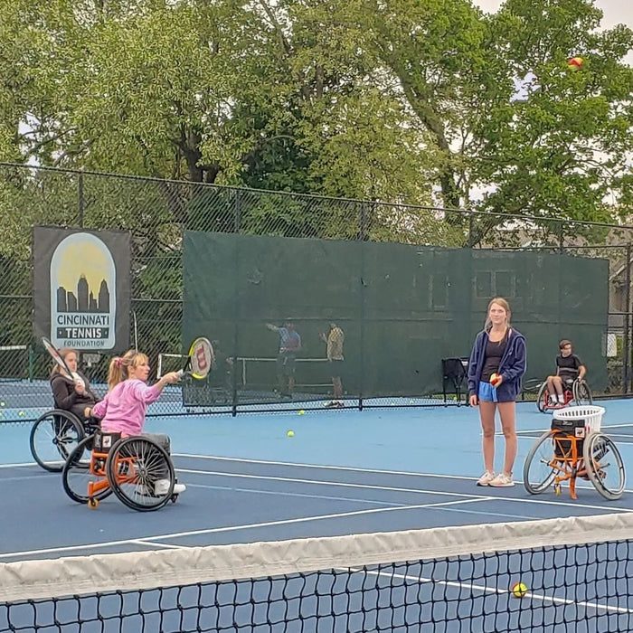 A Cincinnati Tennis Foundation advanced wheelchair tennis participant  getting ready to serve.