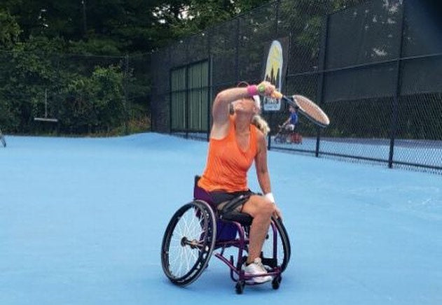 A Cincinnati Tennis Foundation advanced wheelchair tennis participant  getting ready to return a serve.