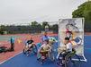 Group portrait of Cincinnati Tennis Foundation intro to wheelchair tennis participants and coach.