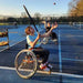 Cincinnati Tennis Foundation intro to wheelchair tennis participant about to return a serve.