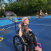 Cincinnati Tennis Foundation intro to wheelchair tennis participant about to return a serve.