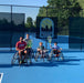 Group portrait of Cincinnati Tennis Foundation intro to wheelchair tennis participants and coaches.