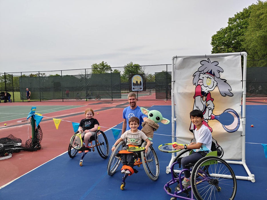 Group portrait of Cincinnati Tennis Foundation intro to wheelchair tennis participants and coach.