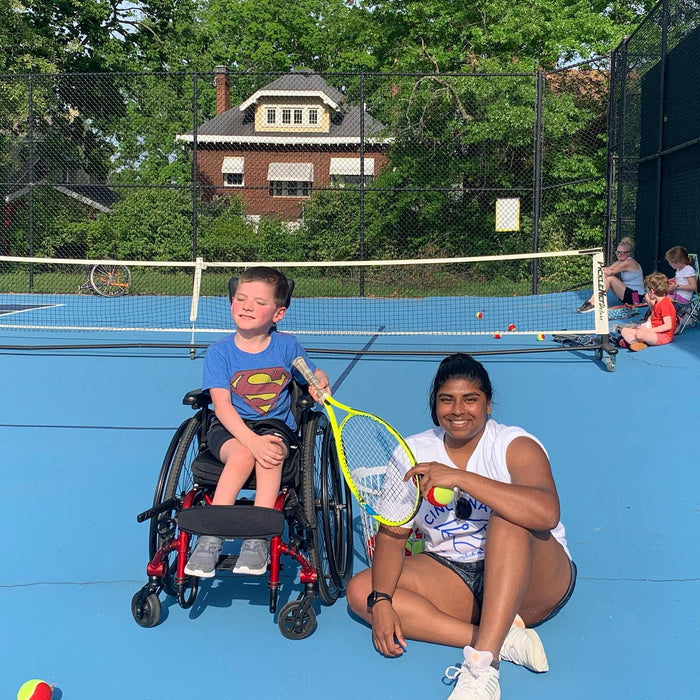 Group portrait of Cincinnati Tennis Foundation intro to wheelchair tennis participant and coach.