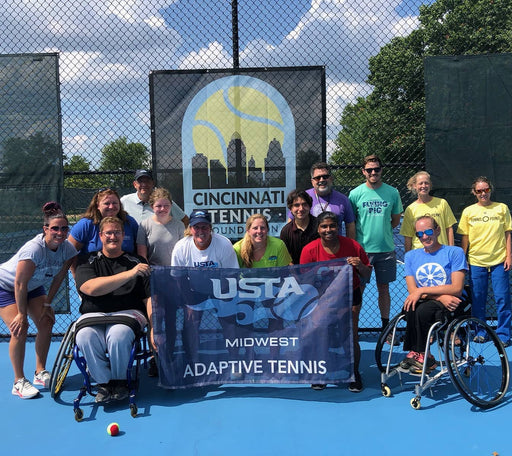 Group portrait of Cincinnati Tennis Foundation intro to wheelchair tennis participants and coaches.