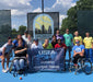 Group portrait of Cincinnati Tennis Foundation intro to wheelchair tennis participants and coaches.