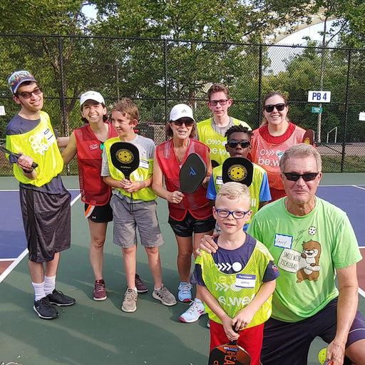 Group portrait of Cincinnati Tennis Foundation Coaches with pickleball participants