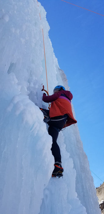 A Paradox Sports climber ascending the icewall at the Lake City Ice Skills 201.