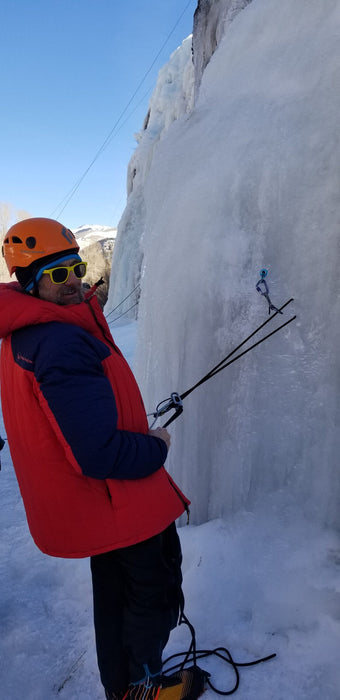 A Paradox Sports climber testing their threads in the icewall at the Lake City Ice Skills 201.