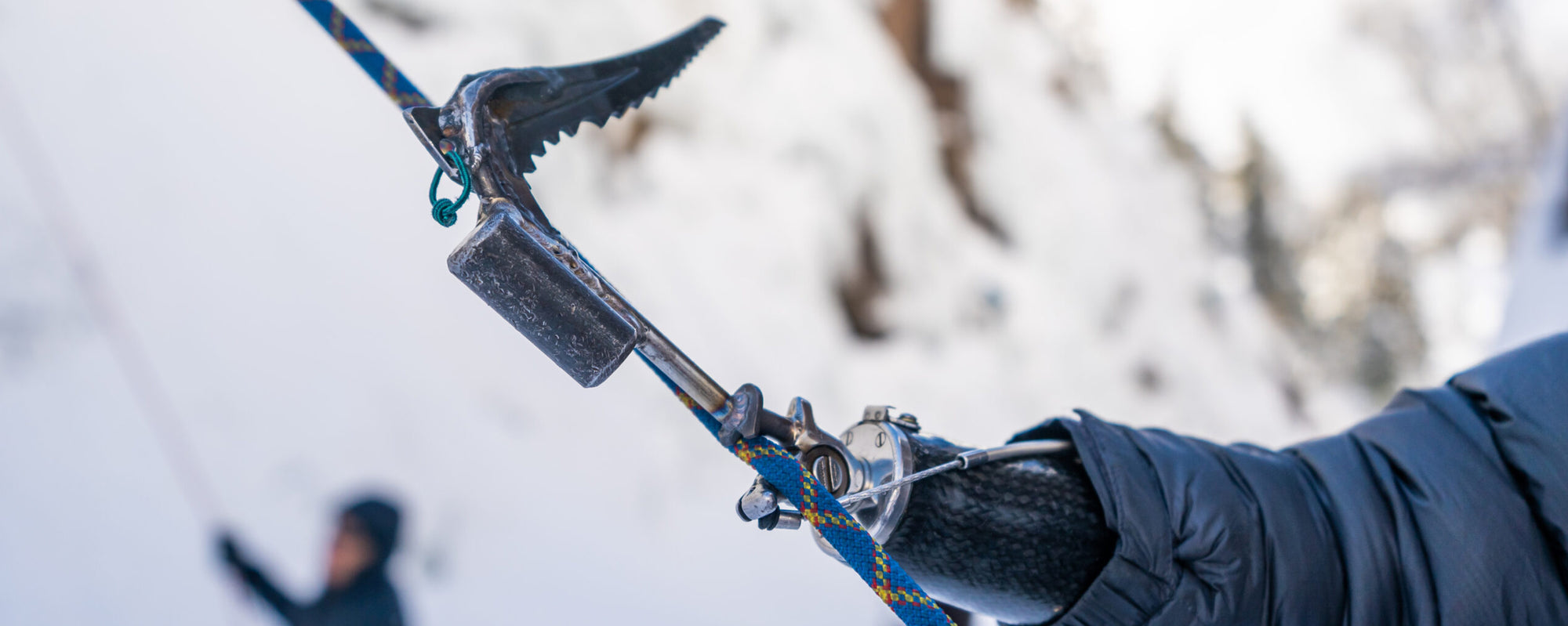 Detail of a prosthetic hook attaching to a climbing rope.